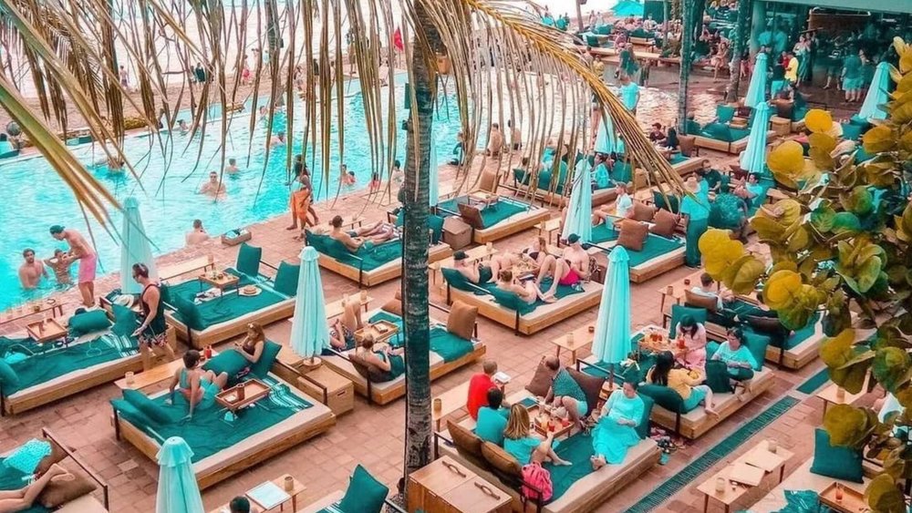 Beach club in Bali overlooking the ocean at sunset